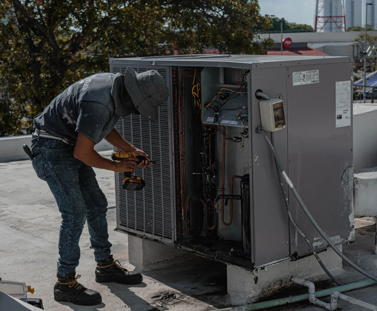 Certified HERS rater performing field verification on residential HVAC outdoor unit Sacramento County